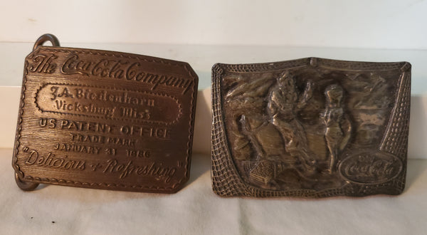 Pair of brass Coca-Cola belt buckles