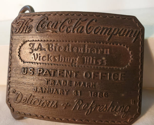 Pair of brass Coca-Cola belt buckles