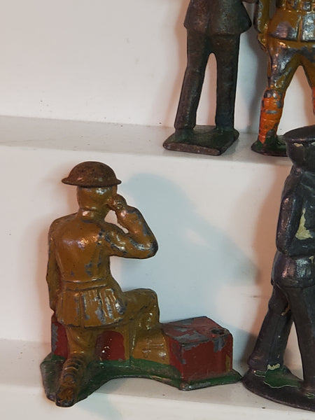 Lot of 7 WWII lead toy soldiers